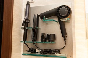 Hair dryers, straight irons, and curling irons are available in the changing rooms of your rooms.