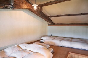 The spacious loft space can accommodate two futons.