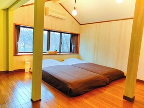 Western-style room with two beds. Relax by the window with a lake view.