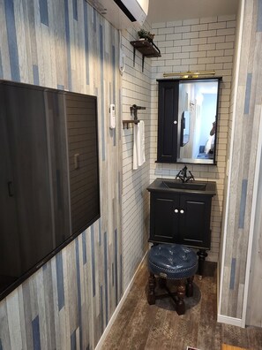 TV and sink on the second floor