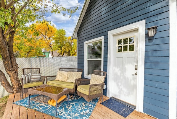 Spacious deck with comfortable seating at Cozy Great Falls Retreat by Wrecked & Refined – perfect for unwinding after a day of exploring Great Falls.