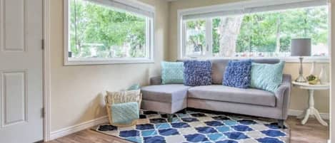 Bright and inviting living room - Designer Cottage by Wrecked & Refined