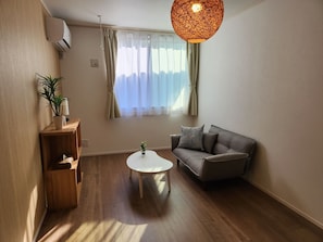  Living room: Chairs, table, air conditioner, WiFi, flame retardant curtains, detector