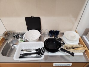 Kitchen utensils: pots, frying pans, glasses, cups, chopsticks, spoons, forks, plates, etc.