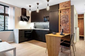 Matt-blacked out kitchen included dishwasher, coffeemaker and micro.
PS! The surface may be perceived as filthy, but has been thoroughly cleaned