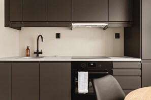 The kitchen is fully equipped with all the utensils you need to prepare your favorite meals at home.