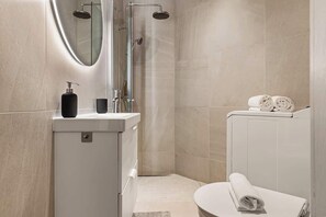 Small but with great features:
- Rain shower
- Heated flooring
- Washing machine
- LED mirror ☞ making it easy to get ready for your day or night out!