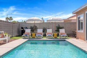 Lounge in luxury by the pool, where sophistication meets sunshine.