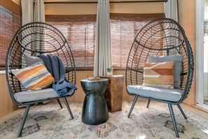 Chic retreat: Twin egg chairs, cozy corner for coffee moments.