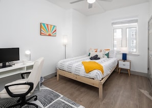 Bedroom #1 with a comfy Queen bed & desk workstation!