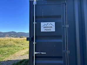 Bridger Peaks sign on shipping container door.