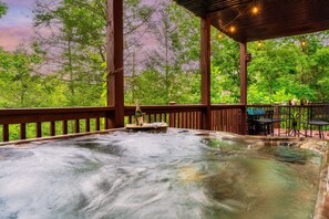 Soak away your troubles at the Honeysuckle Lodge Cabin!