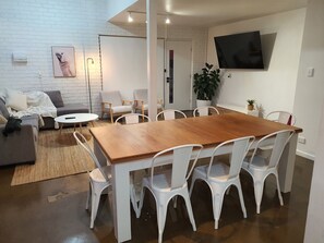 Expandable table - extra seats stored under stairs