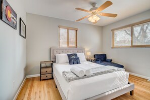 Queen sized bed with a lounge chair