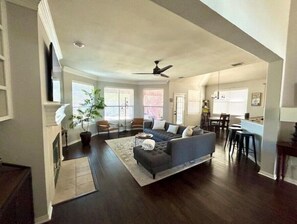 Downstairs, main Living/kitchen/bar area with door to patio/yard/pool.