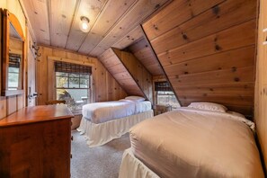 Two upstairs bedrooms provide comfortable places to rest.