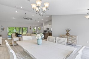 Elegant Dining Room with Expansive Front Yard Views, Perfectly Blending with Adjacent Living, Kitchen and Outdoor Spaces