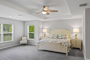 Serenity Found: Master Bedroom with Ensuite and Tranquil Backyard Views