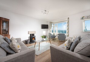 Chy an Mor, First Floor: The sitting area with a cosy wood-burning stove