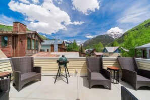 Balcony - The balcony has a BBQ and seating areas and a beautiful view of the mountains