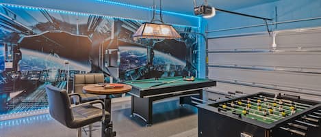 Game room with pool table and foosball table