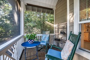 Enjoy morning coffee in relaxing rocking chairs.