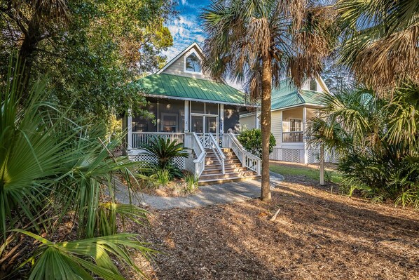 Front of house overlooks the golf course and features a screened porch.