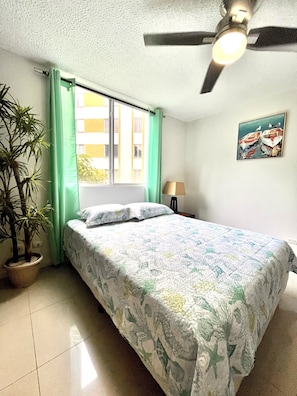 Master bedroom queen bed and ceiling fans