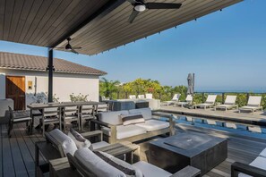 Ocean view with pool, hot tub, outside dining, fire pit, lounging.