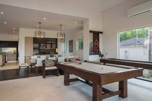 Pool table, shuffleboard table, dining table, minibar