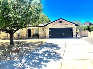 Front of house with 2 car garage and driveway parking