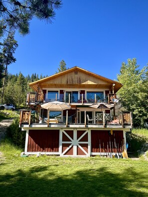 The view of the spacious decks and backyard from the shore. 