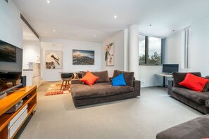 Relax in our comfy lounge room, designed for ultimate comfort with plush seating and a warm, inviting atmosphere. It’s the perfect spot to unwind, watch a movie, or enjoy a quiet evening in.