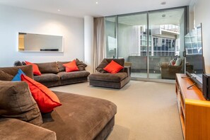 Relax in our comfy lounge room, designed for ultimate comfort with plush seating and a warm, inviting atmosphere. It’s the perfect spot to unwind, watch a movie, or enjoy a quiet evening in.