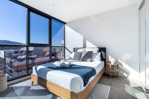 Sleep peacefully in a queen-sized bed with impeccably laundered linens, and enjoy the bright, airy feel of the room enhanced by abundant sunlight from large windows.