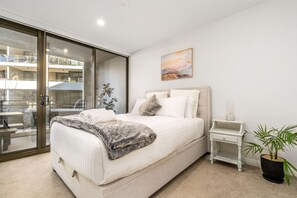 "Enjoy a restful stay in our comfy bedroom, featuring professionally laundered linen. The fresh, crisp bedding and cozy furnishings create a relaxing retreat for a perfect night’s sleep.