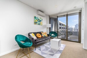 Experience relaxation in our bright and airy lounge room. With ample natural light streaming through large windows, this space offers a cheerful and welcoming atmosphere.