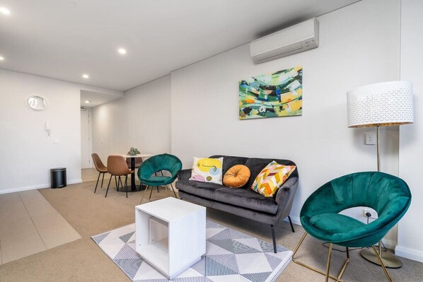 Experience relaxation in our bright and airy lounge room. With ample natural light streaming through large windows, this space offers a cheerful and welcoming atmosphere.