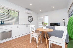 Contemporary kitchen featuring modern fixtures and finishes, offering a stylish and functional space for all your culinary needs.