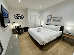 Master Bedroom with 50” Smart TV & dedicated workspace