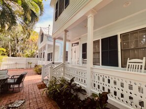 Enjoy the enchanting charm of our private front patio and rocking chairs.