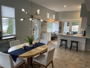 Open concept includes a wall of windows that look out at the river. 