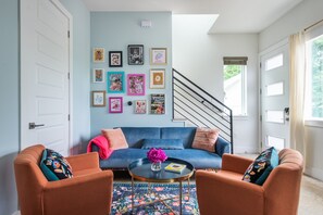 The living spaced is blessed with an abundance of natural light and photo ops