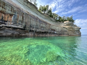 Visit Pictured Rocks in Munising, only an hour away.