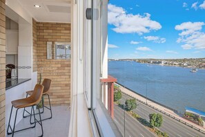 Take things slow up at the breakfast bar, while enjoying the river views.
