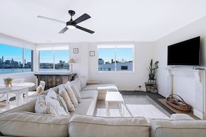 An oversized sofa in the living room means there’s plenty of space to relax and unwind.