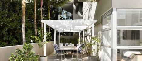 Whether it's a leisurely brunch or a twilight dinner, this patio is the perfect setting for an alfresco dining experience.