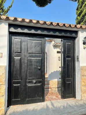 Pedestrian entrance (gated and covered carpark is on opposite side of the villa)