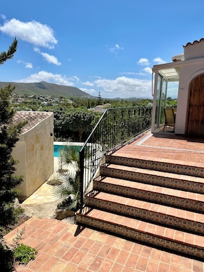 Stairs up to the main level or down to the pool and ground level rooms