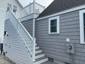 The Beach House offers an outdoor shower and storage for beach gear!